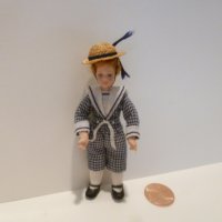 Little Boy wearing blue/white checkered outfit